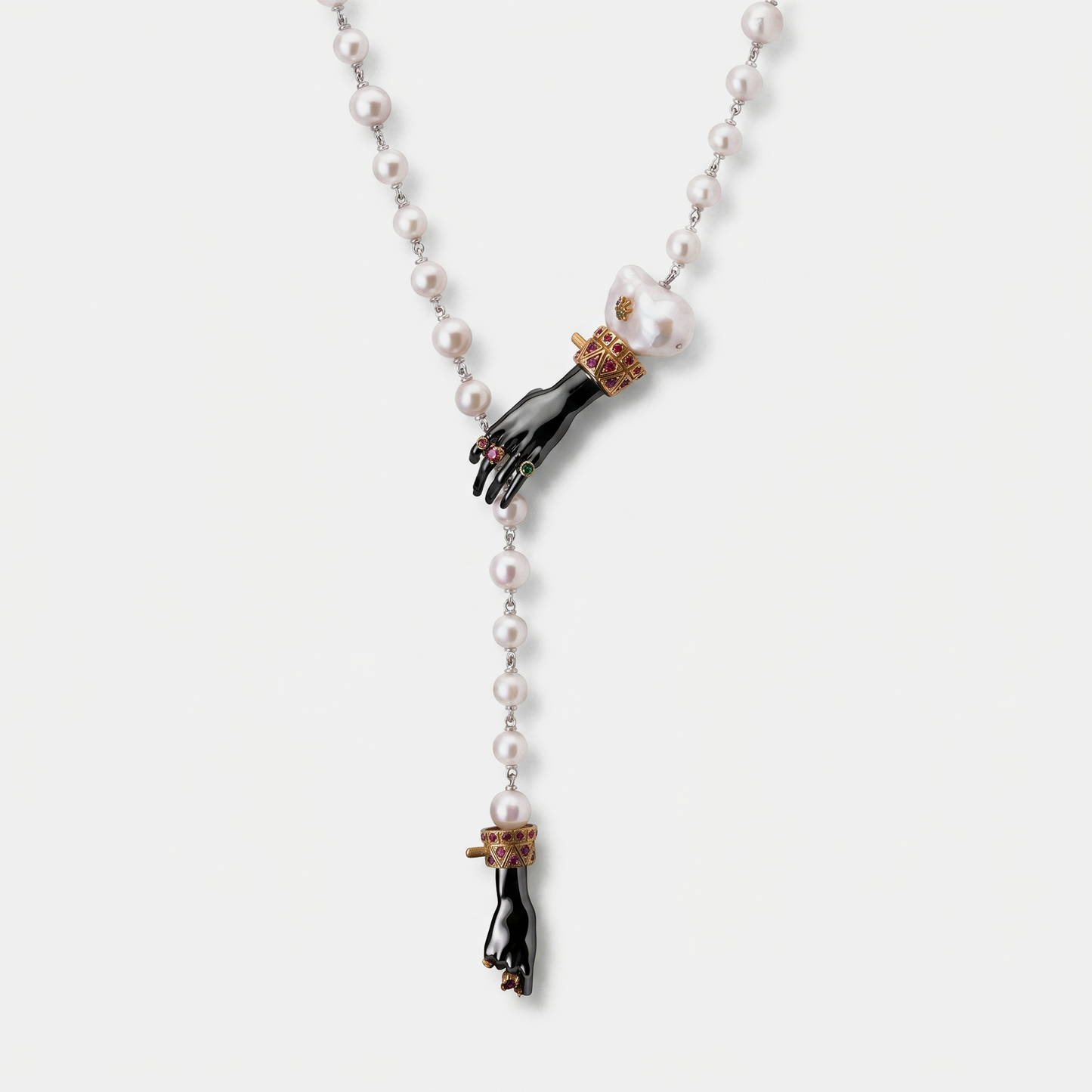 Pearl necklace with sculptural black hand pendant, baroque pearl and gold ruby details, contemporary designer jewellery