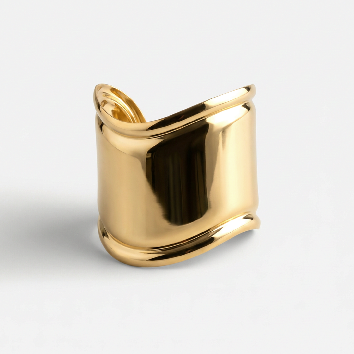 Gold ring on a light gray background