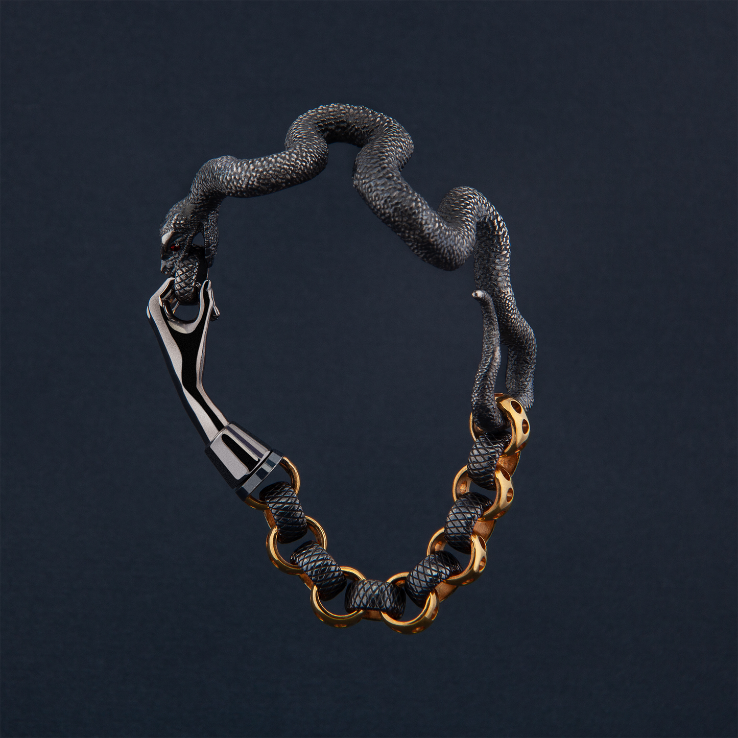 Statement snake bracelet in black and gold on dark background, luxury designer jewellery piece