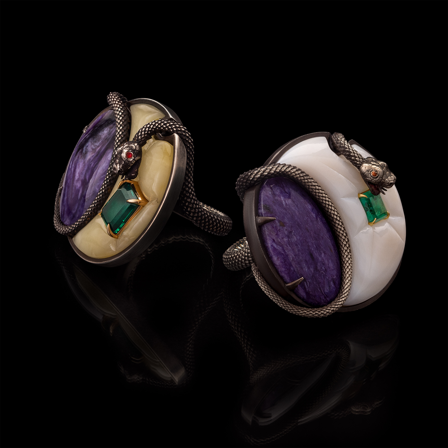 Pair of statement designer rings with purple gemstones, green emerald accents and snake design, artistic jewellery