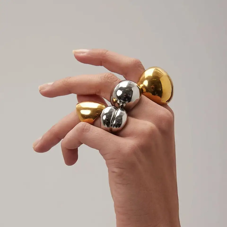 Bold dome-shaped statement ring with a polished gold-tone finish