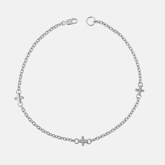 A silver chain anklet featuring three small cross charms and heart charms spaced along the chain, displayed on a light gray background.