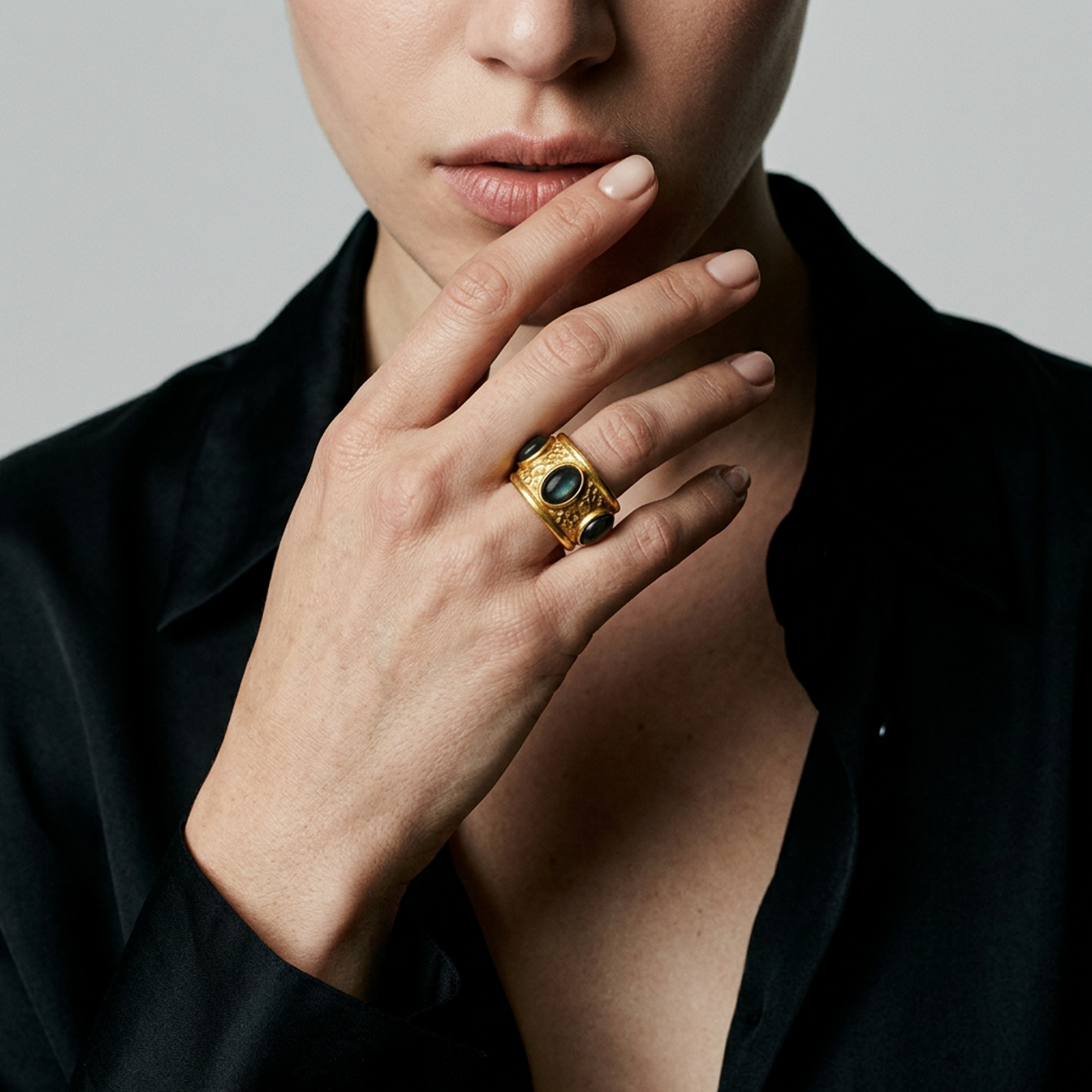 Contemporary textured gold ring with black stones