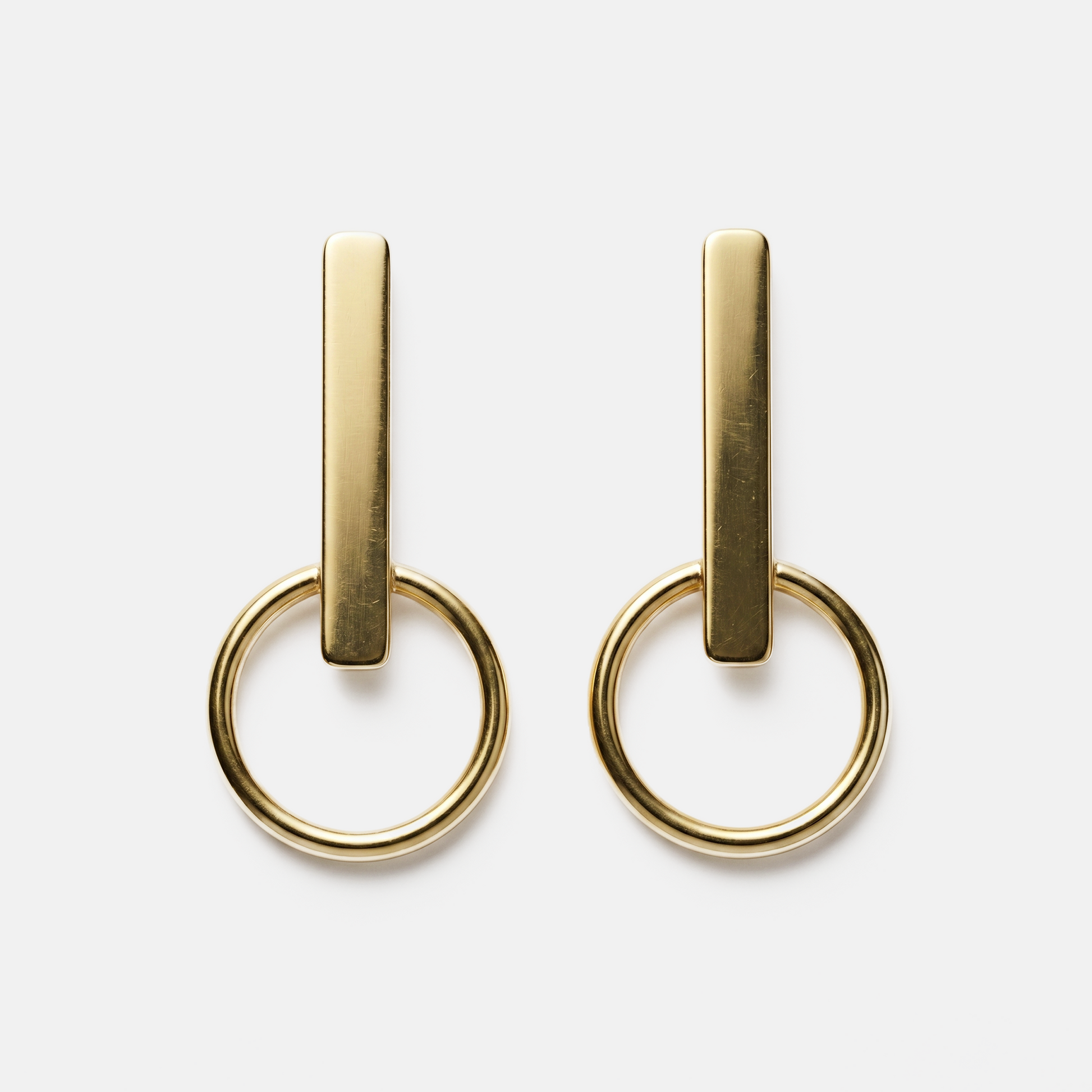 Orbit gold statement earrings with geometric design