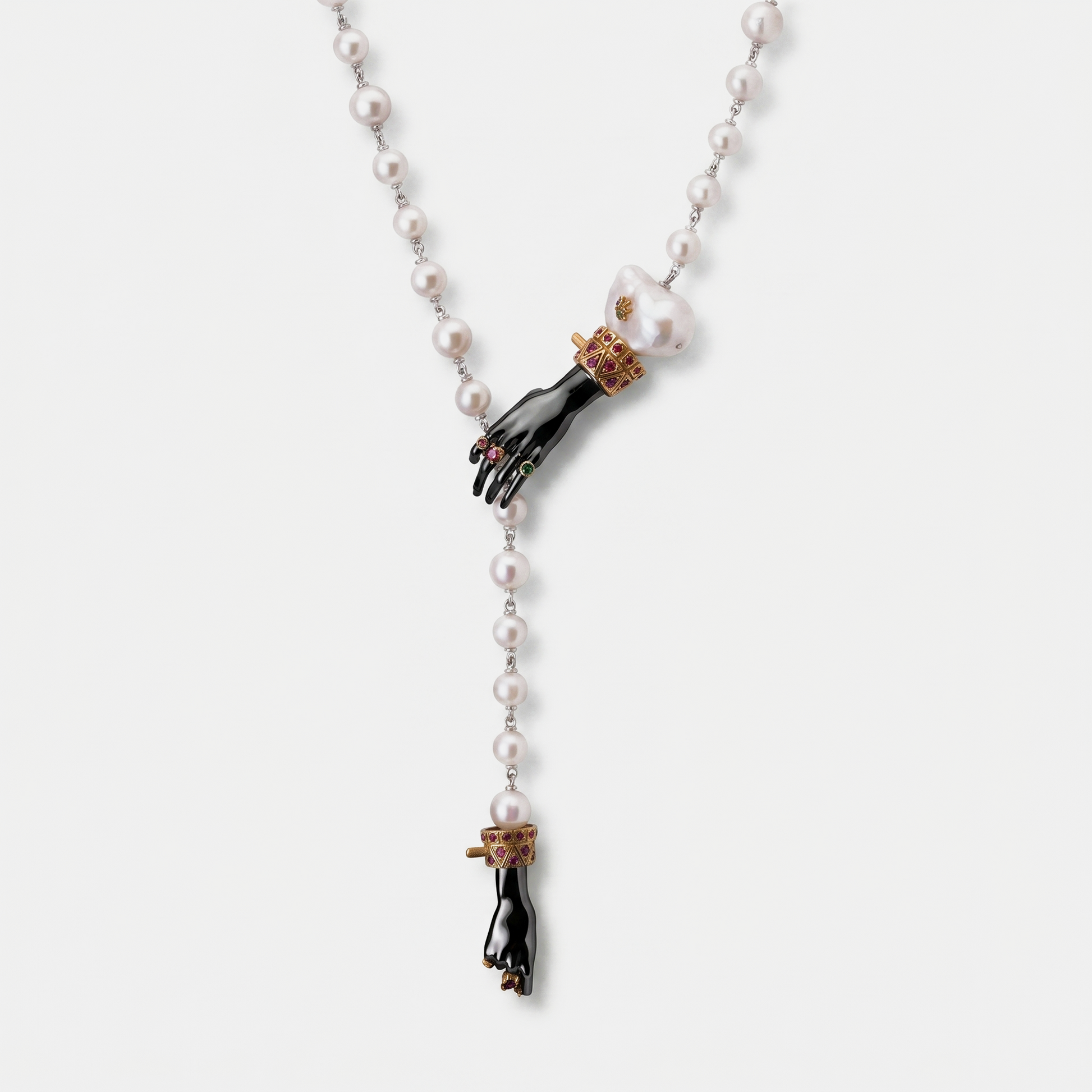 Pearl necklace with sculptural black hand pendant, baroque pearl and gold ruby details, contemporary designer jewellery