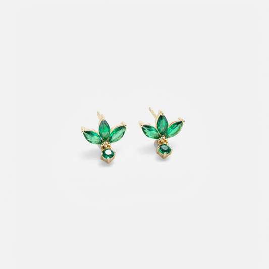 A pair of gold stud earrings featuring marquise-cut green gemstones arranged in a leaf-like cluster with a smaller green stone hanging below, shown on a light gray background.
