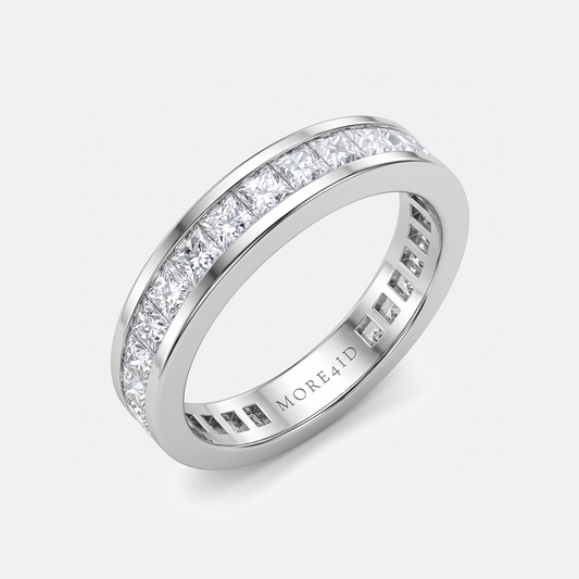 A silver-tone eternity ring with a channel-set row of clear round-cut diamonds on one side and a beveled edge on the other, shown on a light gray background. The inside of the band is engraved with the brand name 'MORE41D'.