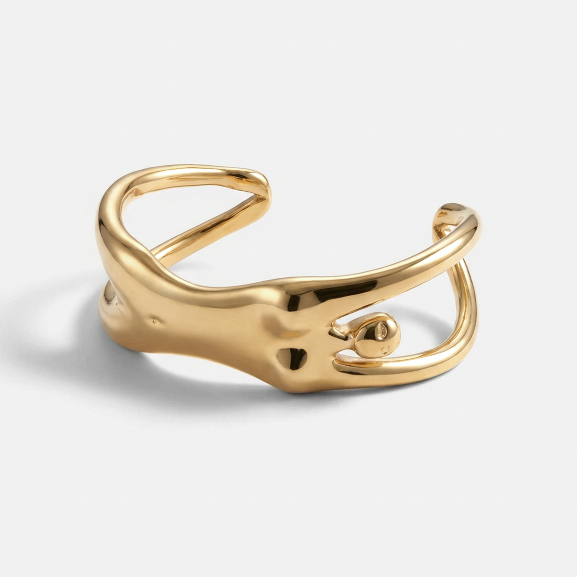 Gold open ring on a light gray background