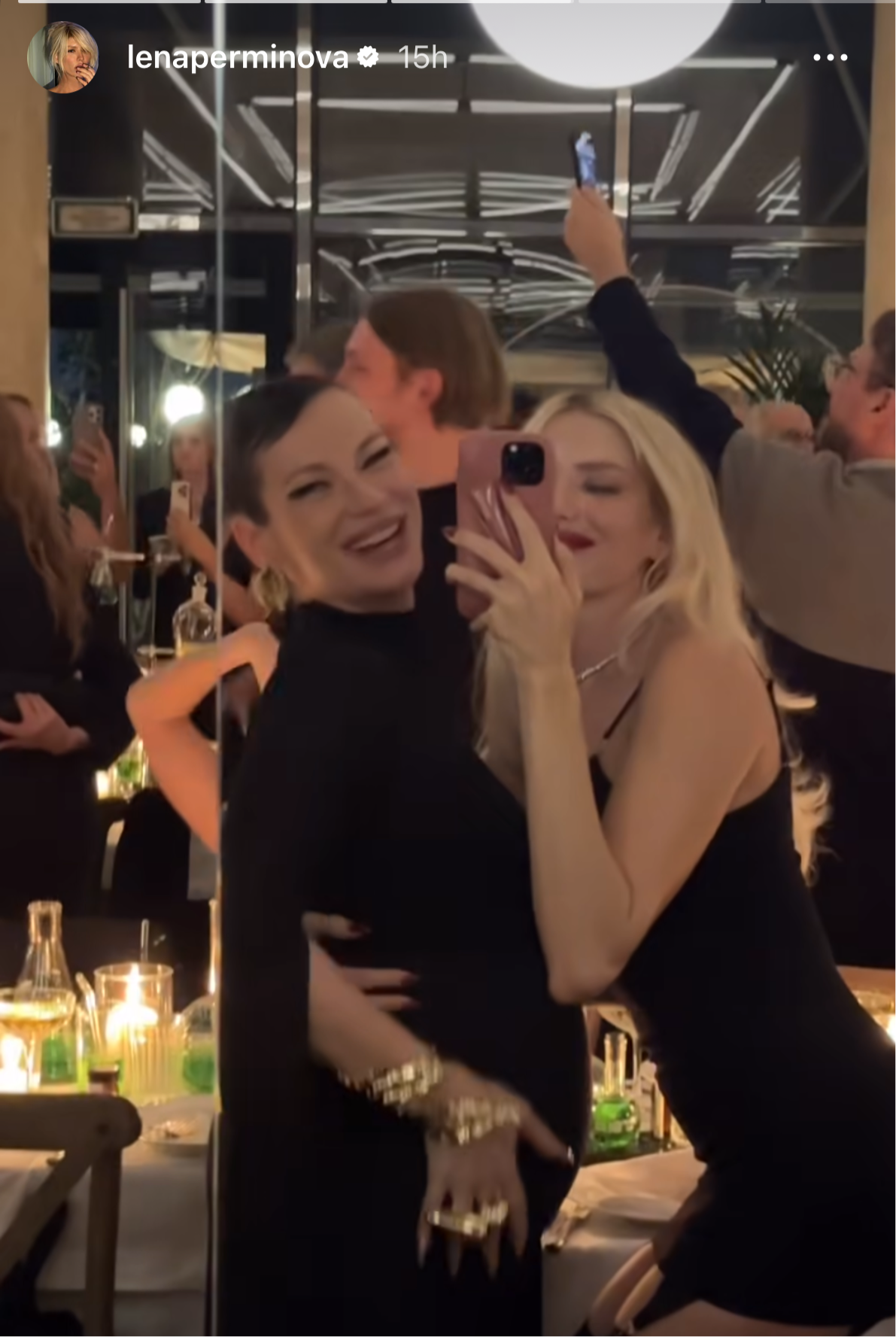 A silver-tone metal cuff bracelet with a leaf pattern.