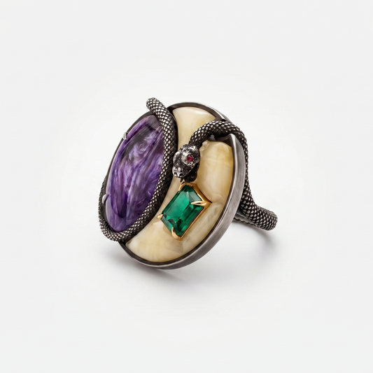 Statement designer ring with purple gemstone, green emerald and snake detail, contemporary British jewellery