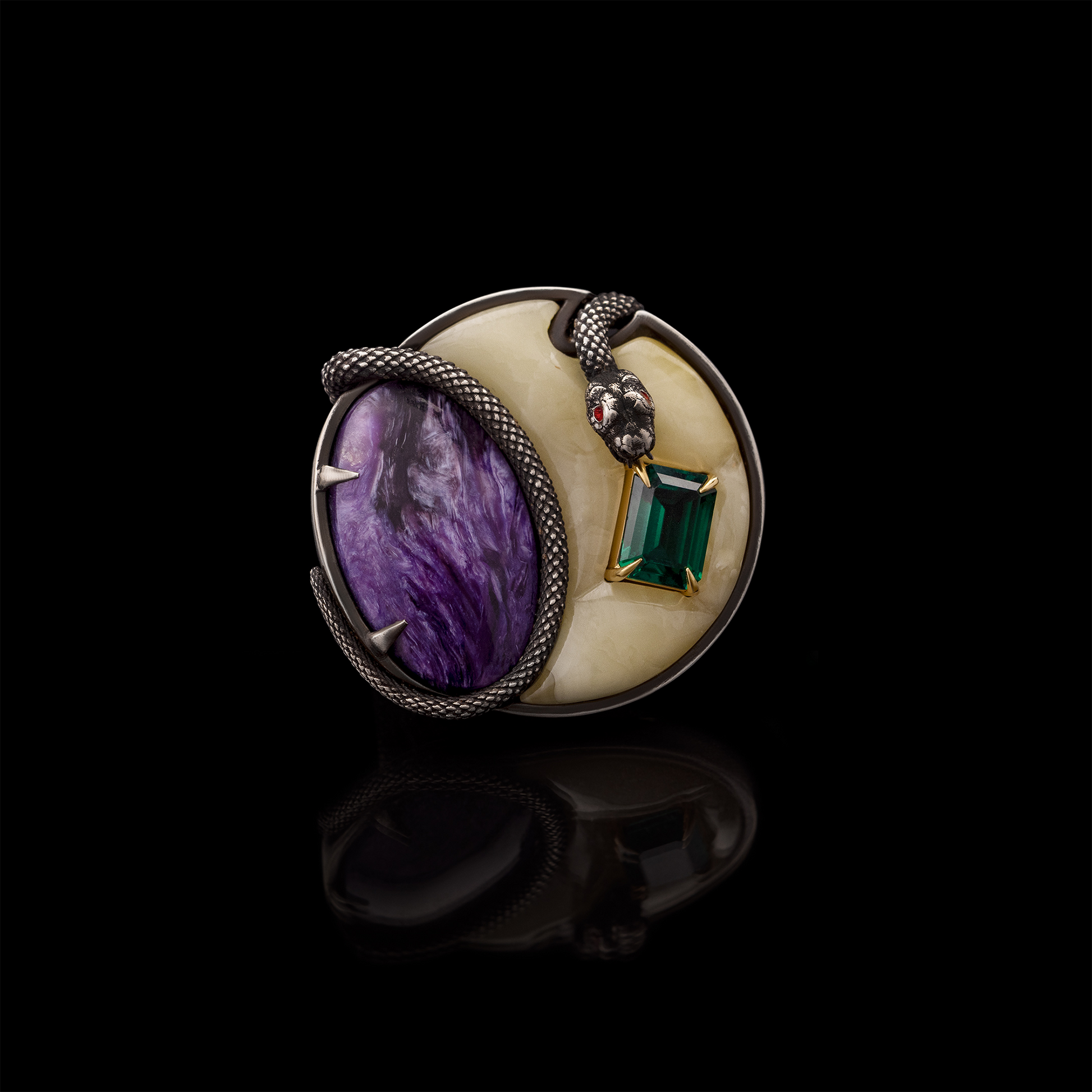 Luxury statement ring with purple stone, green emerald and snake design on black background, artistic jewellery piece