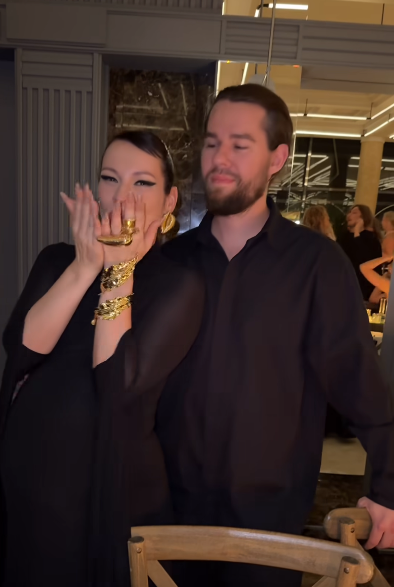 A silver-tone metal cuff bracelet with a leaf pattern.