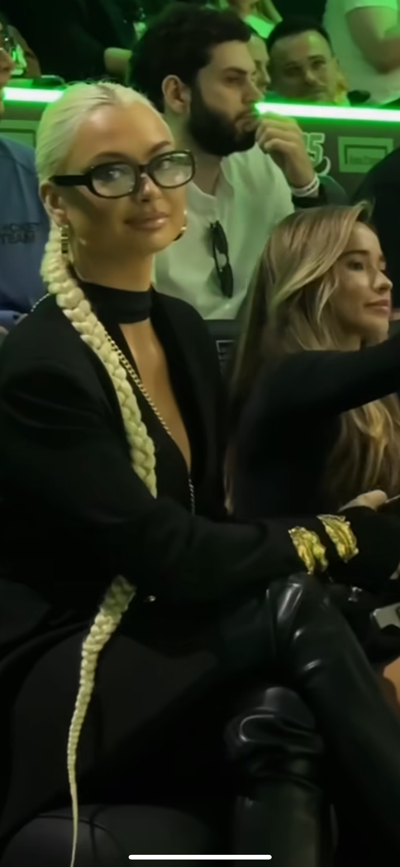 A silver-tone metal cuff bracelet with a leaf pattern.