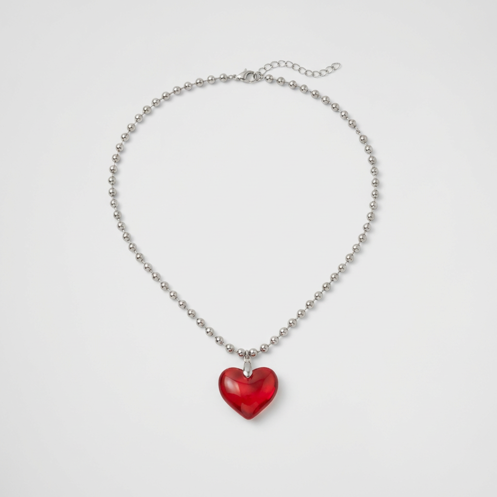 Necklace with a red heart pendant on a light gray background