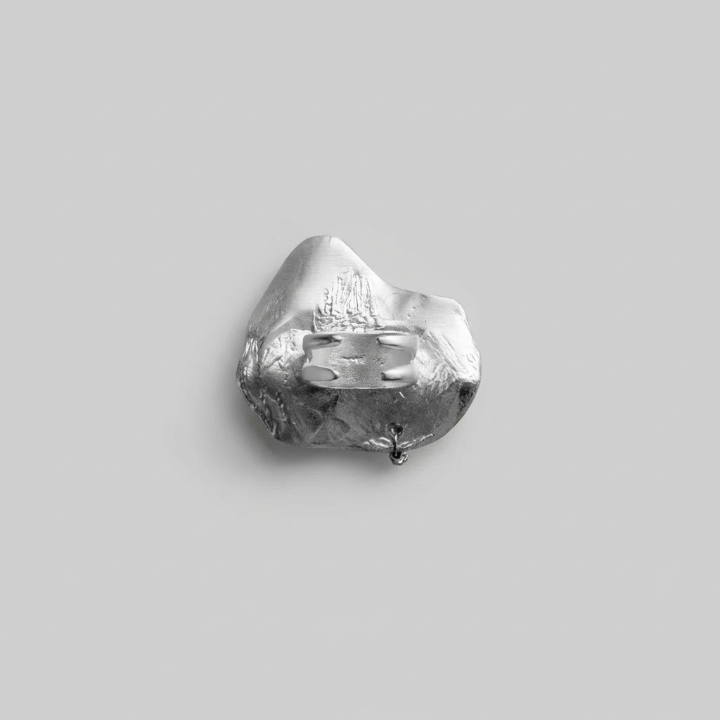 Silver ring on a gray background