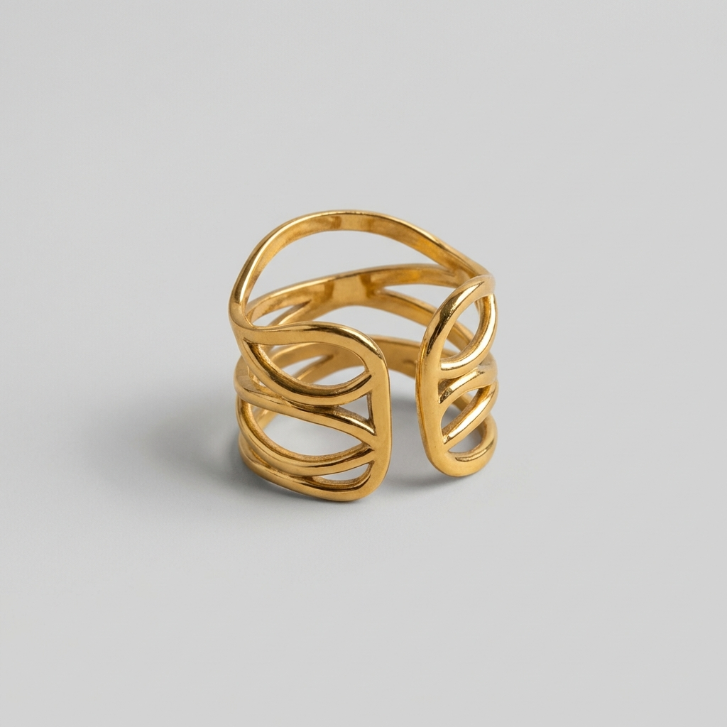 Gold ring with a textured design on a gray background