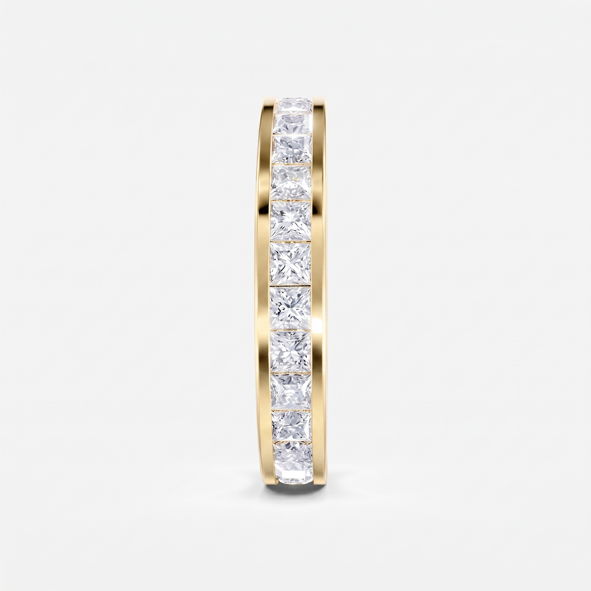 A slim yellow gold eternity ring featuring a full channel setting of princess-cut clear diamonds, shown vertically against a clean white background.